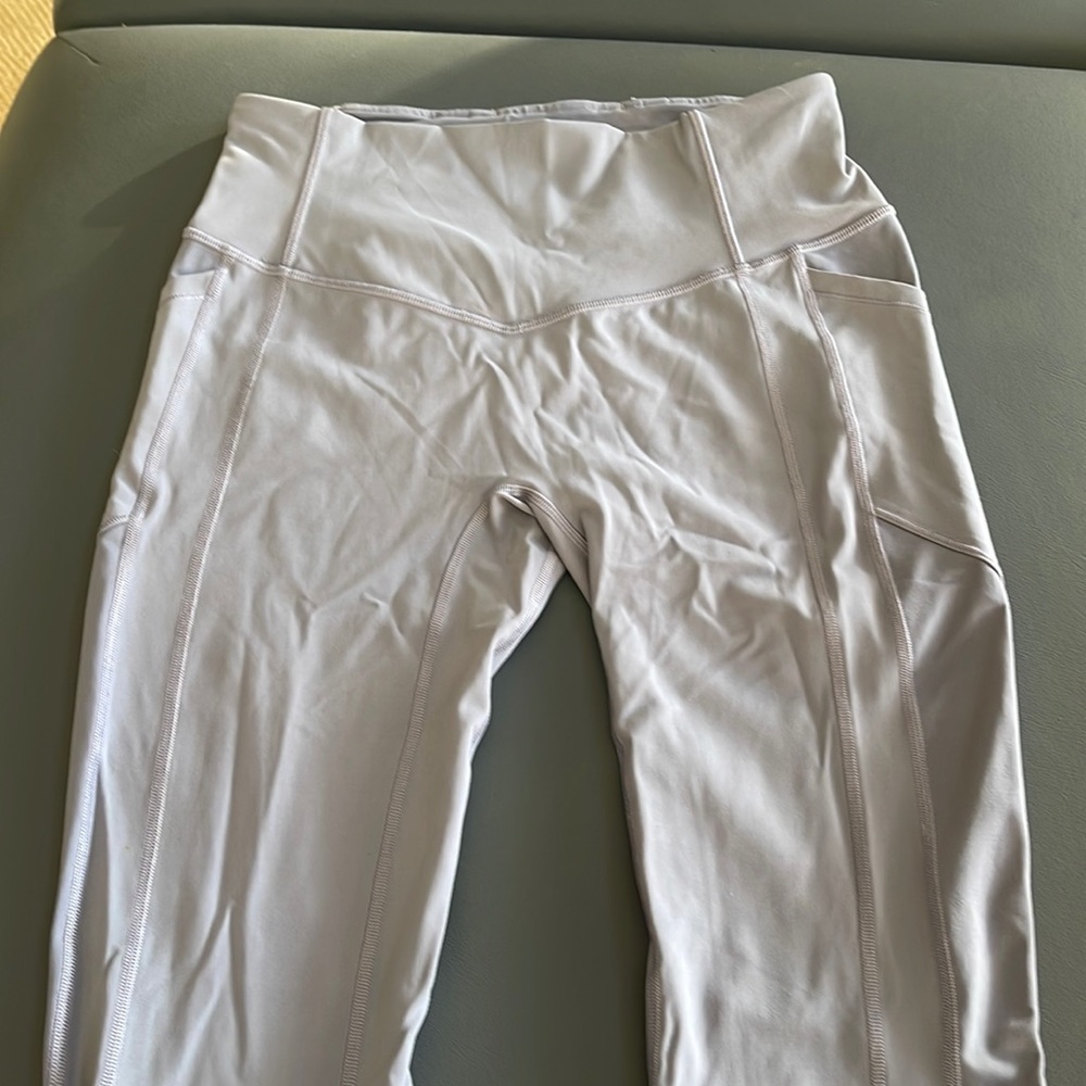 Lululemon purple capri tights with side pockets size 8